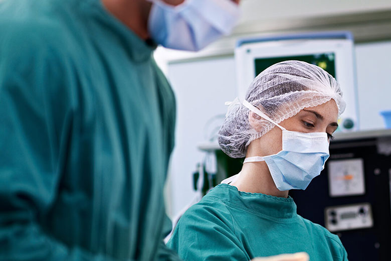 Female surgeon prepping