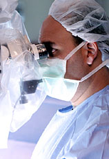Carlos David, MD, during neurosurgery