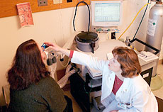 Lissa Judd administering a pulmonary function test on an asthma patient